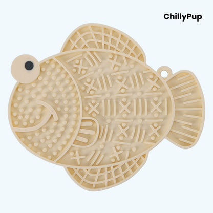 Apricot fish-shaped dog lick pad on a white background, branded 'ChillyPup'.