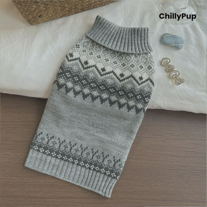 Gray knitted dog sweater with a pattern on a wooden surface, branded 'ChillyPup'.