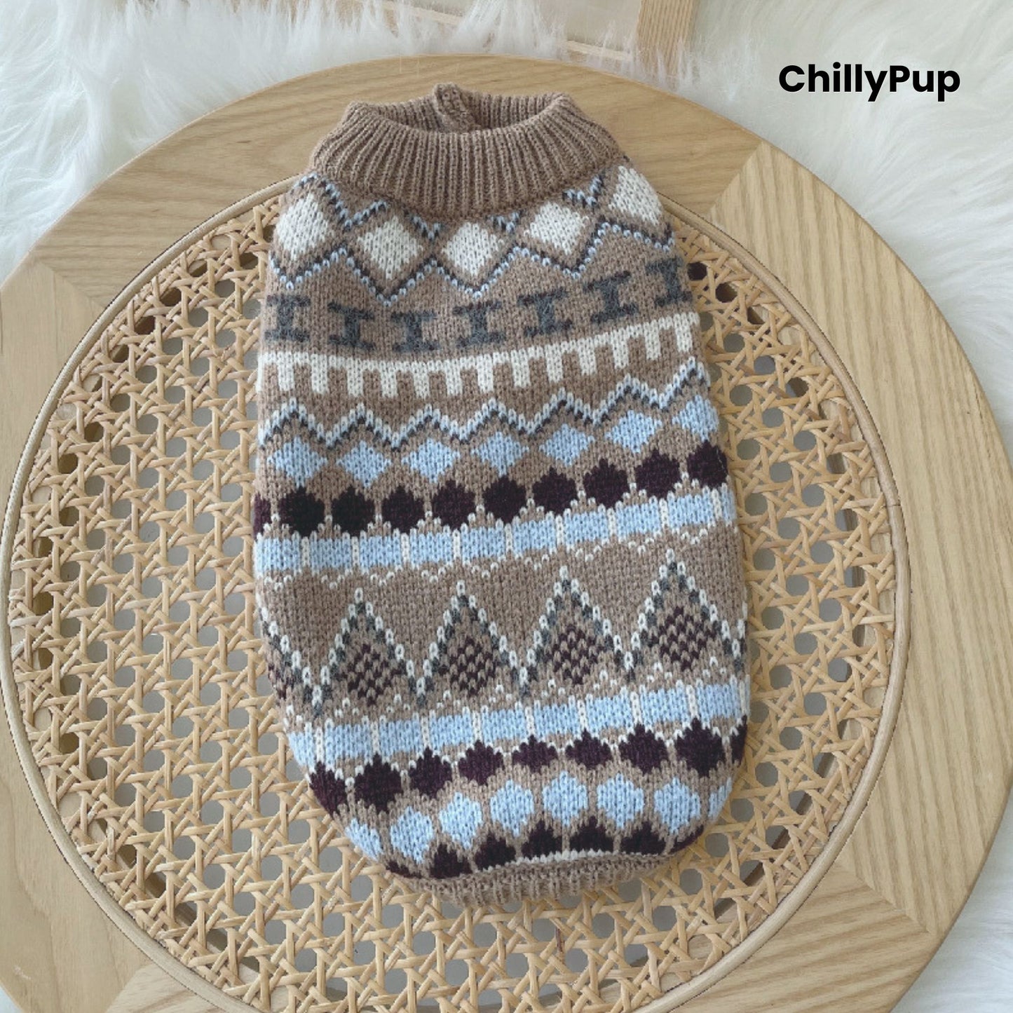 Patterned dog sweater on a wooden surface with 'ChillyPup' branding.