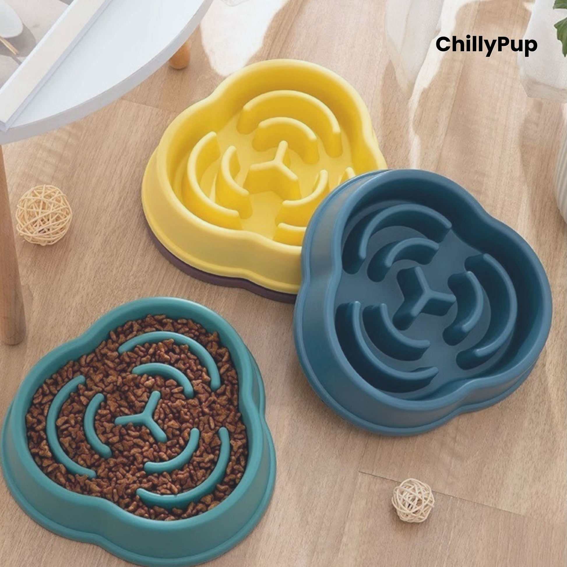 Three pet bowls with maze design on a wooden surface, branded 'ChillyPup'.
